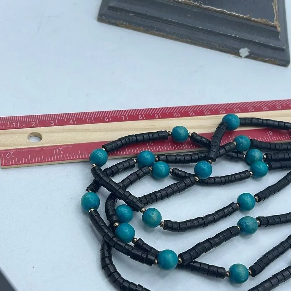 Vintage 4 strand wooden beaded boho festival necklace.